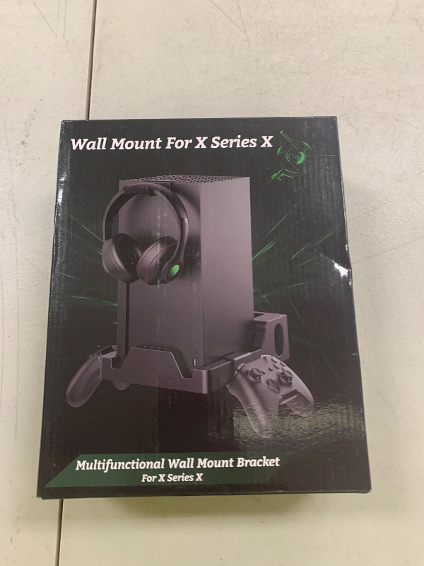 Photo 1 of Wall Mount for Xbox Series X Console - Sturdy Wall Shelf Kit Load Up to 45Lb, Dual Ventilation Design, Place Xbox Front Facing and Prevent from Falling (with 2 Controller Holder and 1 Headphone Stand)