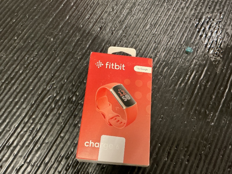 Photo 1 of Fitbit Charge 6 Fitness Tracker with Google apps, Heart Rate on Exercise Equipment, 6-Months Premium Membership Included, GPS, Health Tools and More, Gold/Coral, One Size (S & L Bands Included)