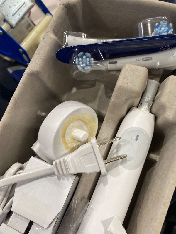 Photo 1 of *MAJOR DAMAGE*
Oral-B Rechargeable Electric Toothbrush, iO2 Starter Kit, 3 Cleaning Modes, Automatic Pressure Sensor to Protect Gums, 2 Brush Heads, Pure White