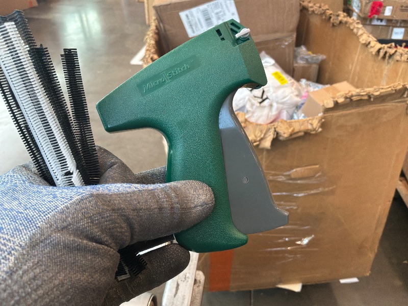 Photo 1 of [Green Stich gun not pink] Stitch  For Clothes - Handheld Stitch Gun Quick Clothing Fixer - Tagging Gun - Includes 6 Needle, 1000 Black Fasteners & 1000 White Fasteners