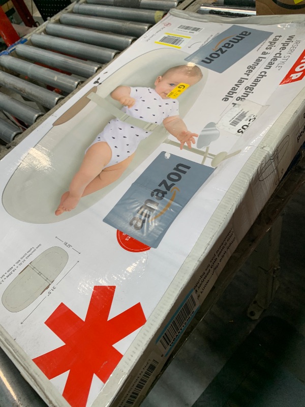 Photo 1 of ****AS IS FINAL SALE NO RETURNS ****ISkip Hop Baby Changing Pad Nursery Style Wipe-Clean Contoured with Cushioned Foam, Non-Skid Base, Built-in Safety Belt & Tuck-Away Toy Bar, Oat