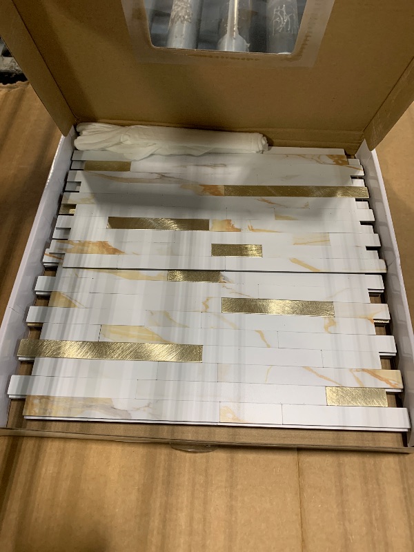 Photo 1 of *** PACK OF 4 *** STICKGOO 20 Sheets Peel and Stick Backsplash Tile, Stick on Backsplash for Kitchen and Bathroom, Calacatta Gold Marble Look PVC Mixed Gold Self Adhesive Wall Tiles