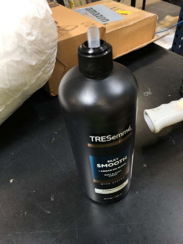 Photo 1 of TRESemmé Silky & Smooth Anti-Frizz Conditioner for Frizzy Hair Formulated With Pro Style Technology 28 Fl oz