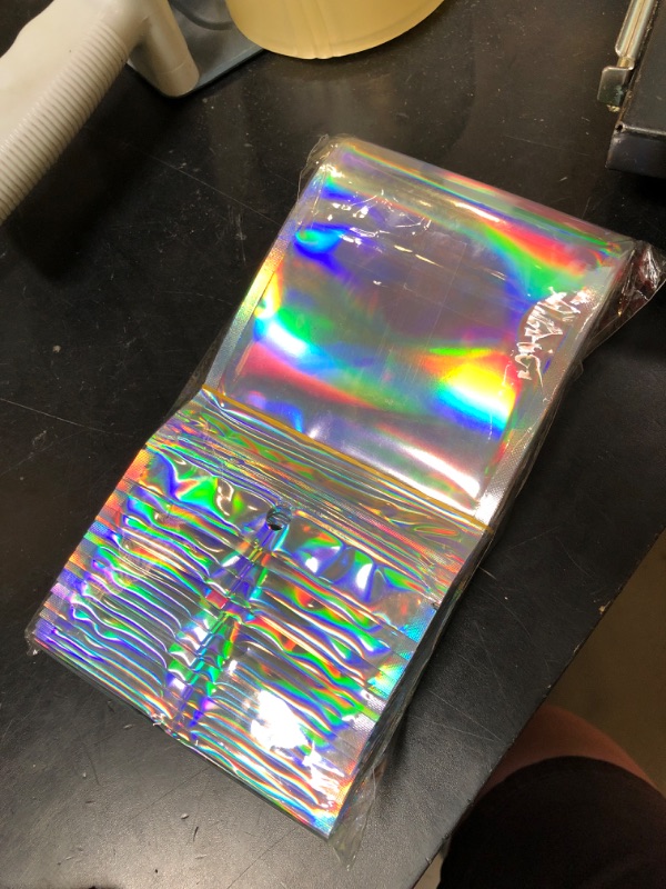 Photo 1 of 100 Pcs Holographic Resealable Packaging Bags for Small Business Supplies, Cute Small Color Smell Proof Foil Pouch Plastic Baggies for Lip Gloss Soap Party Food Storage (4x6 inch)