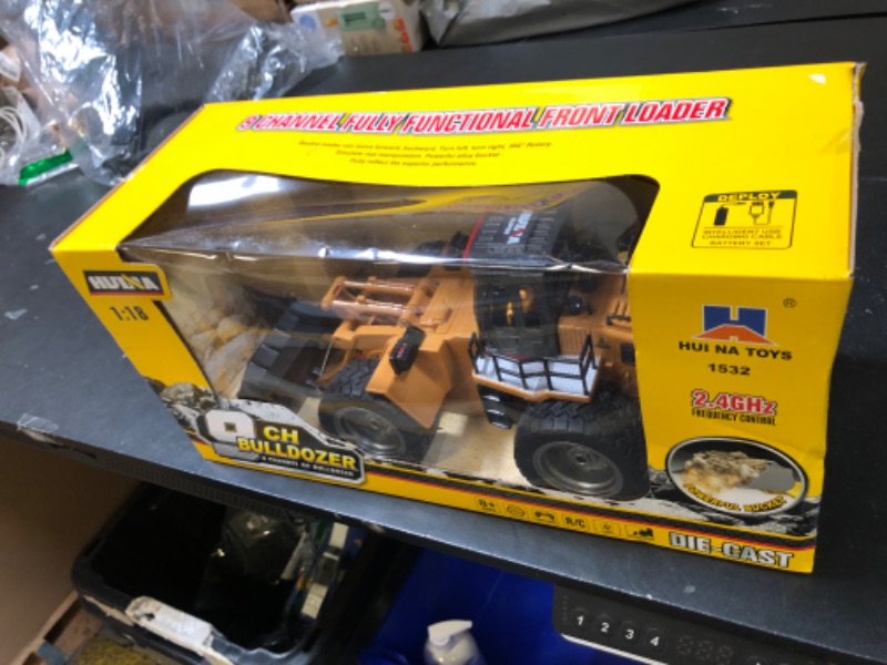 Photo 1 of Fistone 9 Channel RC Front Loader, 4WD Alloy Shovel Loader Tractor, 2.4Ghz RC Bulldozer Construction Vehicle Radio Control Tractor Truck Toy with Lights for Kids Age 8-12 Years Old