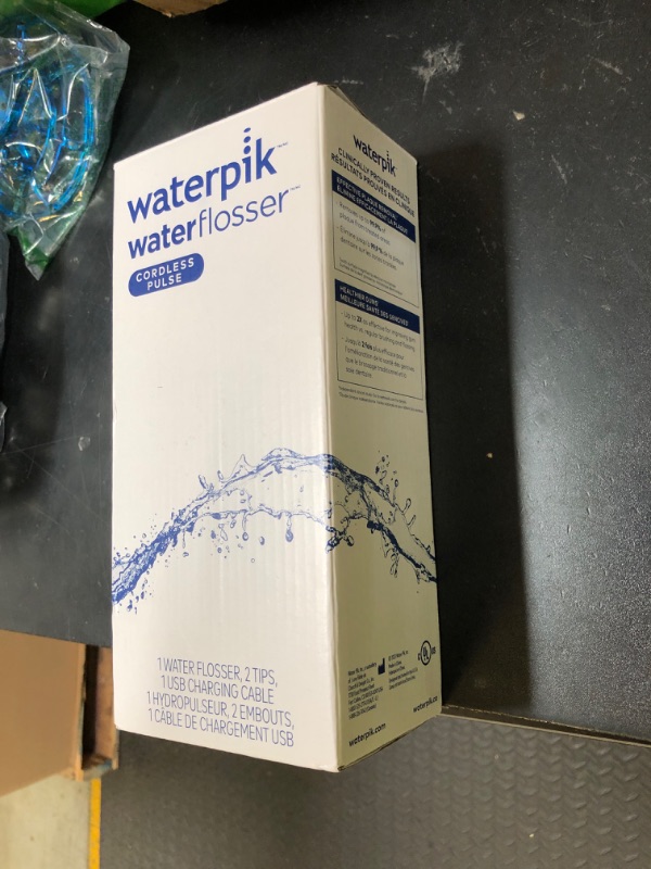 Photo 1 of Waterpik Cordless Pulse Rechargeable Portable Water Flosser for Teeth, Gums, Braces Care and Travel with 2 Flossing Tips, Waterproof, ADA Accepted, WF-20 Blue, Packaging May Vary