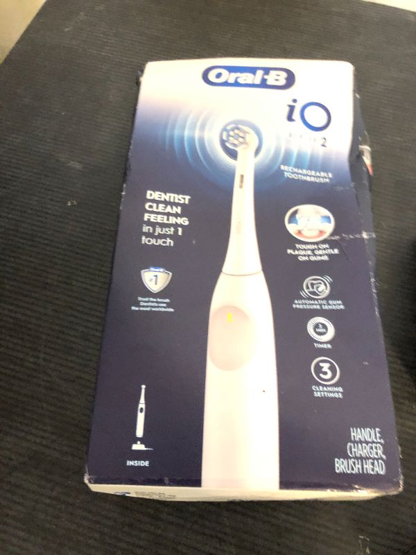 Photo 1 of Oral-B iO Series 2 Rechargeable Electric Powered Toothbrush, Pure White with 1 Gentle Care Brush Head - Automatic Pressure Sensor to Protect Gums - 3 Modes - 2 Min Timer
