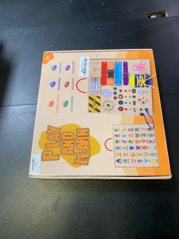 Photo 1 of 23 in 1 Busy Board Montessori Toys for 1-3 Year Old Wooden Learning Educational Toy for Toddlers with 15 Switches, 26 LED Lights, Music Boxes, Locks,Zippers Toddler Sensory Toys for Soothing A Baby
