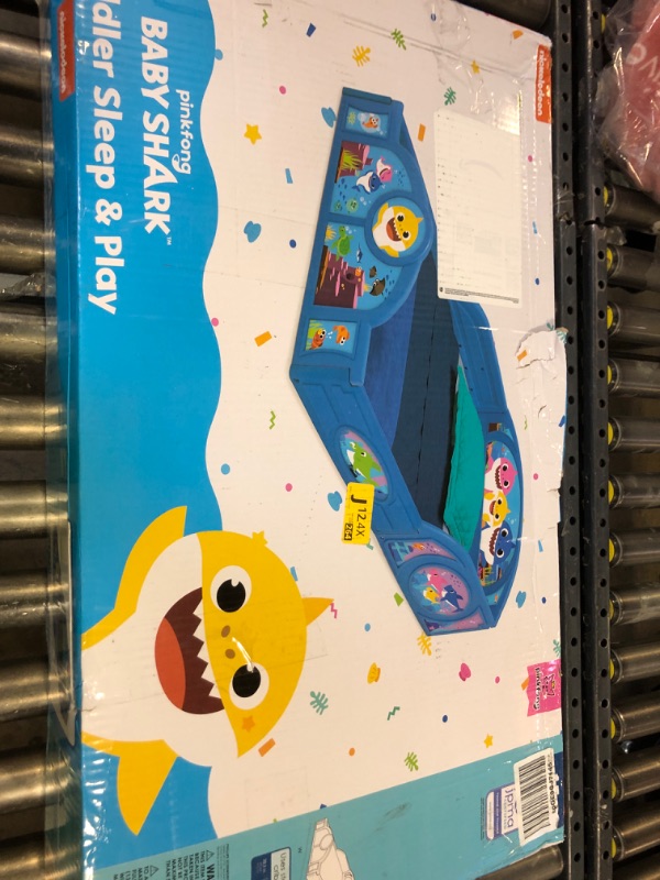 Photo 1 of Baby Shark Plastic Sleep and Play Plastic Toddler Bed with Attached Guardrails by Delta Children, Blue