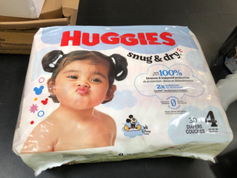 Photo 1 of Huggies Size 4 Diapers, Snug & Dry Baby Diapers, Size 4 (22-37 lbs), 30 Count, Packaging May Vary