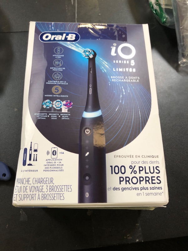 Photo 1 of Oral-B iO Series 5 Rechargeable Electric Toothbrush with Visible Pressure Sensor to Protect Gums, 2 Minute Timer, 5 Cleaning Settings, 1 Replacement Toothbrush Heads, and Travel Case, Black