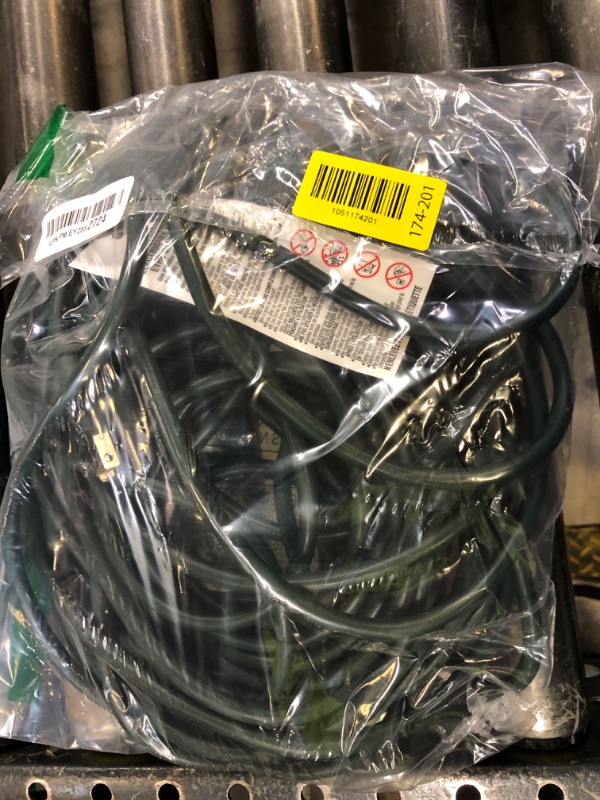 Photo 1 of Amazon Basics 50-foot 3-Prong Vinyl Indoor/Outdoor Extension Cord - 13 Amps, 1625 Watts, 125 VAC, Green