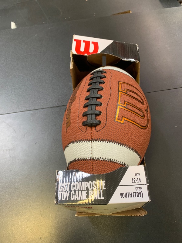 Photo 1 of Wilson GST Leather Game Football - Brown, Youth Size