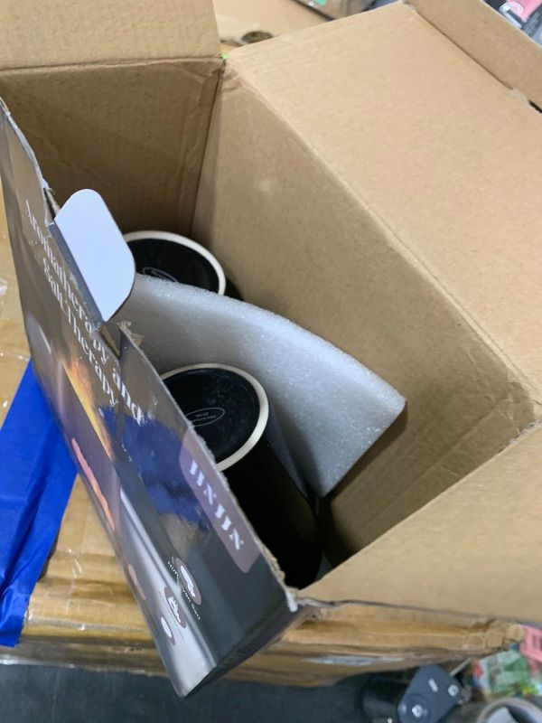 Photo 1 of two black mugs 