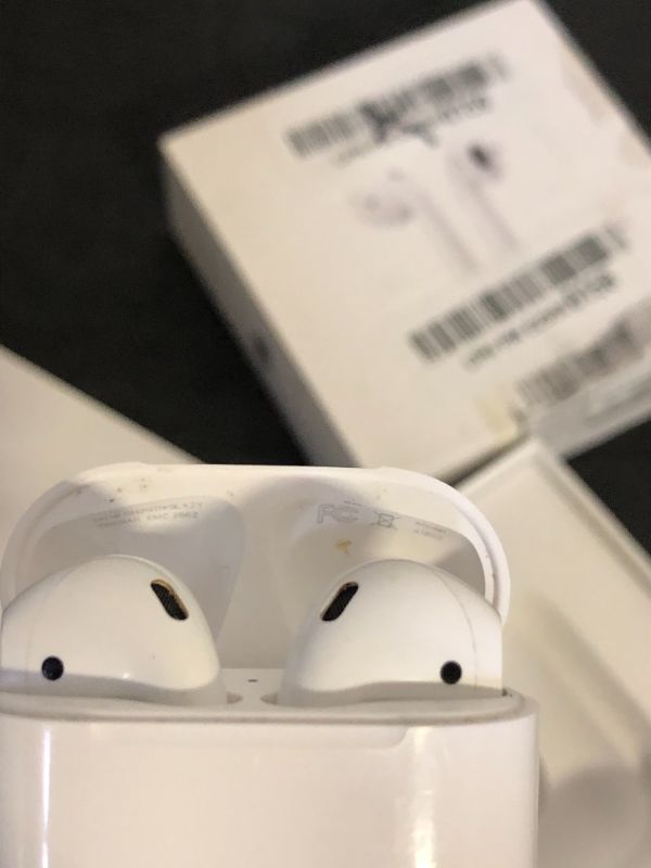 Photo 1 of Apple AirPods Wireless Ear Buds, Bluetooth Headphones with Lightning Charging Case Included, Over 24 Hours of Battery Life, Effortless Setup for iPhone