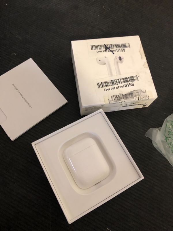 Photo 1 of Apple AirPods Wireless Ear Buds, Bluetooth Headphones with Lightning Charging Case Included, Over 24 Hours of Battery Life, Effortless Setup for iPhone