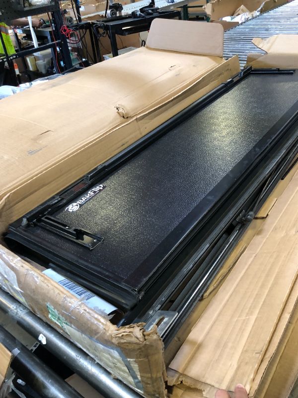 Photo 1 of RealTruck BAK BAKFlip F1 Hard Folding Truck Bed Tonneau Cover | 772130 | Fits 2019-2025 Chevy/GMC Silverado/Sierra, Works w/MultiPro/Flex Tailgate (Will not fit Carbon Pro Bed) 5' 10" Bed (69.9")