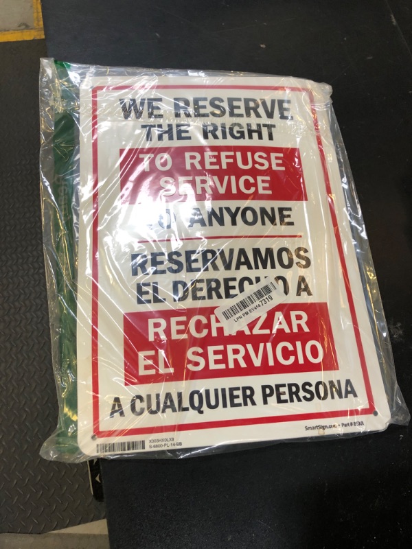 Photo 1 of "We Reserve The Right to Refuse Service to Anyone" Bilingual Sign by SmartSign | 10" x 14" Plastic