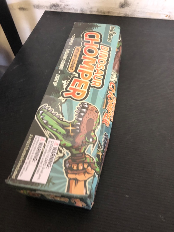 Photo 1 of DINOBROS Dinosaur Chomper Toys for Kids with 3 Roar Sounds and Light Jurassic Dinosaurs Grabber Claw T-Rex Reacher Robot Hand Pincher Dino Snapper