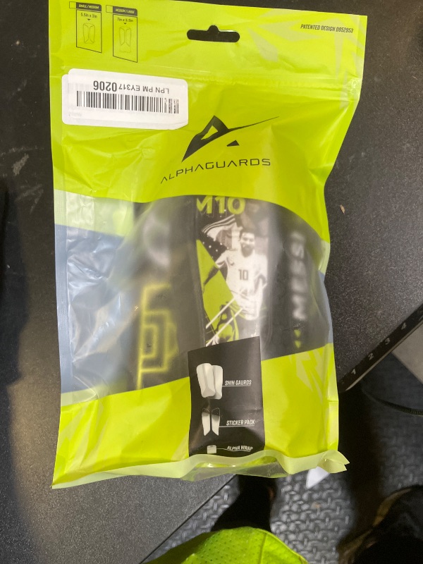 Photo 1 of Alpha Soccer Youth Shin Guards - Soccer Protective Gear, Lightweight Shin Guard Set with Single Straps (S/M, Messi Stickers)