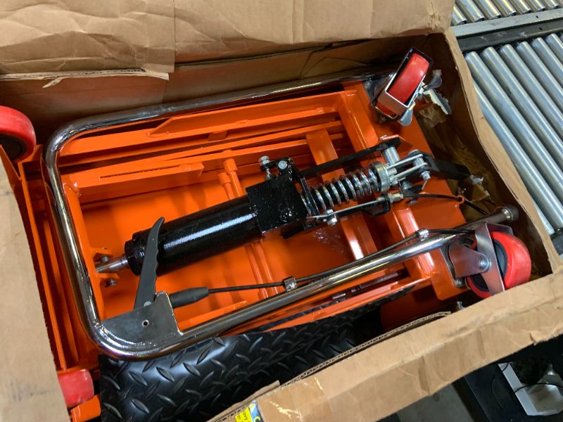 Photo 1 of VEVOR Hydraulic Lift Table Cart, 330lbs Load Capacity 50 Inch Lifting Height, Manual Single Scissor Lift Table with Non-Slip Pad and 4 Wheels, Hydraulic Scissor Cart for Material Handling, Orange