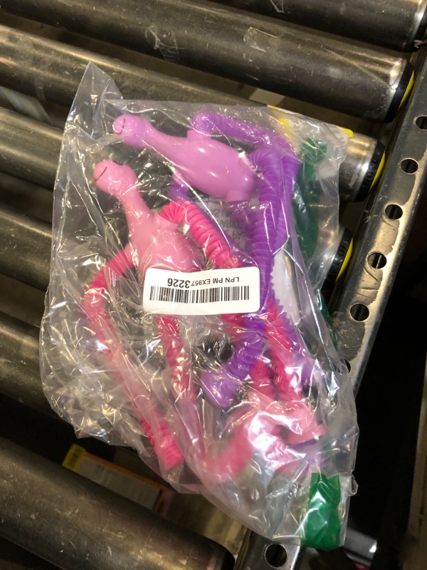 Photo 1 of 4Pcs Dinosaur Stocking Stuffers Airplane Travel Toys for Toddlers Kid Boys Girls Year Old Age 3+ Sensory Suction Tube ADHD Autism Road Trip Car Activities Essential Pop Fidget Toys Autistic Kid Gift