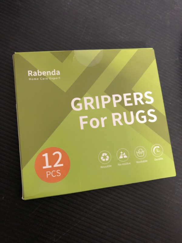 Photo 1 of Rabenda 12 Pcs Rug Tape, Non Slip Rug Pads Grippers for Hardwood Floors and Tiles, Reusable Carpet Tape for Area Rugs, Double-Sided Adhesive Rug Stickers Keep Corners Flat (Black)