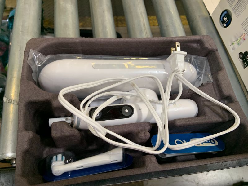 Photo 1 of Oral-B iO Deep Clean + Protect Rechargeable Electric Toothbrush, White with a iO Series 7 Toothbrush, 2 Replacement Brush Heads, and a Charging Travel Case