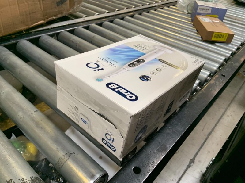 Photo 1 of Oral-B iO Deep Clean + Protect Rechargeable Electric Toothbrush, White with a iO Series 7 Toothbrush, 2 Replacement Brush Heads, and a Charging Travel Case