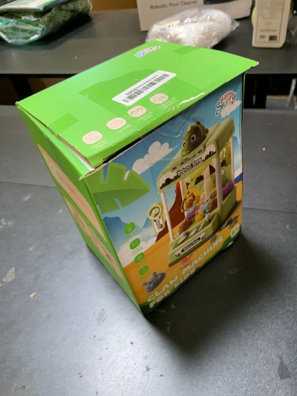 Photo 1 of Skirfy Dinosaur Claw Machines,Electronic Arcade Game Vending Machine with Adjustable Sound& 32Pcs Mini Prizes,Candy Grabber Prize Dispenser Toys for Boys Girls,Birthday Toy Gifts for Kids