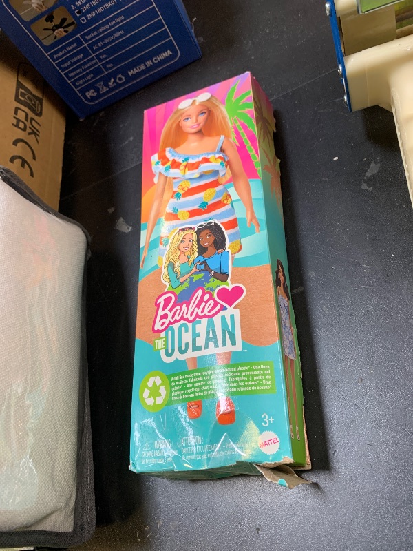 Photo 1 of Barbie Loves the Ocean Doll with Blonde Hair Wearing Floral Sundress & Accessories, Fashion Doll & Clothes Made from Recycled Plastics
