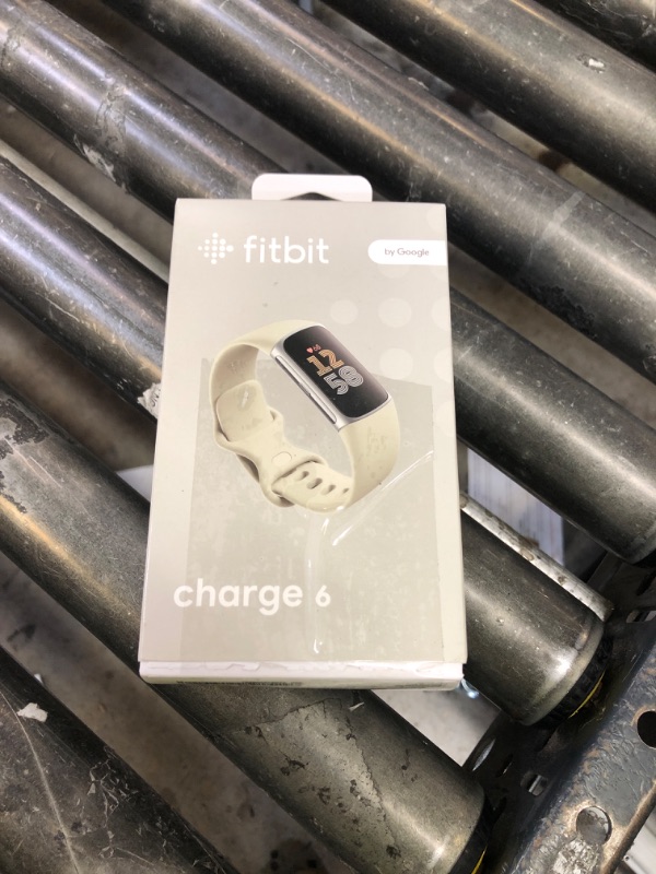 Photo 1 of Fitbit Charge 6 Fitness Tracker with Google apps, Heart Rate on Exercise Equipment, 6-Months Premium Membership Included, GPS, Health Tools and More, Porcelain/Silver, One Size (S & L Bands Included)