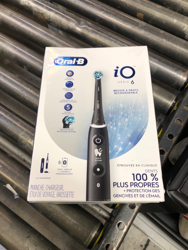 Photo 1 of Oral-B iO Series 6 Rechargeable Electric Toothbrush with Visible Pressure Sensor to Protect Gums, 2 Minute Timer, 5 Cleaning Settings, 1 Replacement Toothbrush Head, and Travel Case, Black