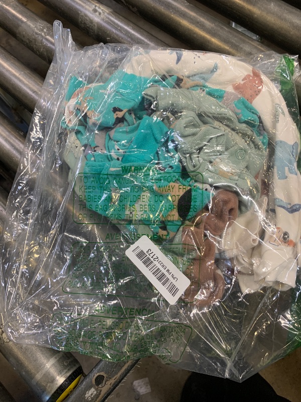Photo 1 of Simple Joys by Carter's Baby Boys' 3-Pack Snug Fit Footless Cotton Pajamas, Navy Space/Rust Stripe/Turquoise Green Dogs, 6-9 Months