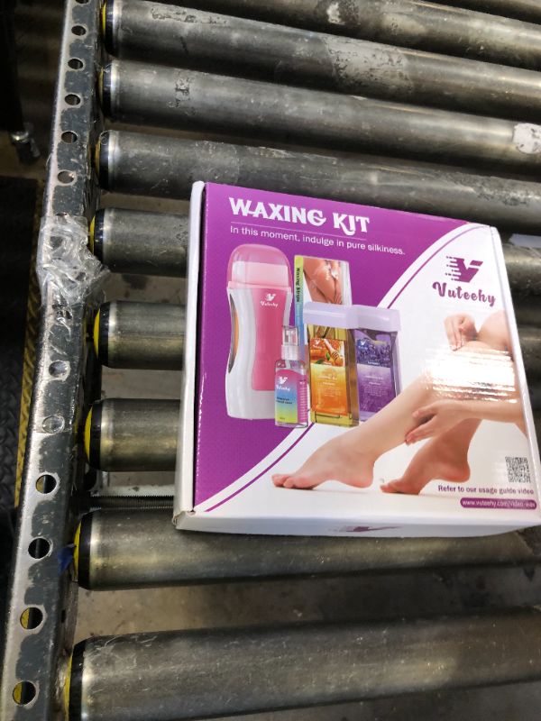 Photo 1 of Vuteehy Roll on Wax Kit, Roll on Waxing Kit for hair removal, Waxing Kit for Women, Wax Roller Kit for All Skin Types for men, with 2 Cartridges & 50 Pcs Strips