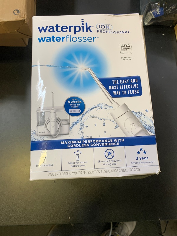 Photo 1 of Waterpik ION Professional Water Flosser, Rechargeable and Portable for Teeth, Gums, Braces, 10 Settings, 7 Flossing Tips For Multiple Users And Needs, ADA Accepted, WF-12 White, Packaging May Vary