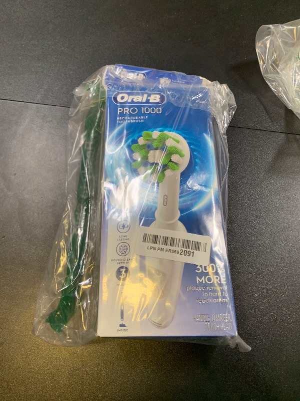 Photo 1 of Oral-B Pro 1000 Rechargeable Electric Toothbrush, White