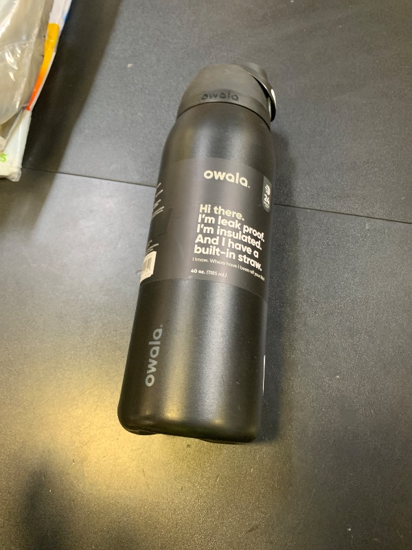 Photo 1 of Owala FreeSip Insulated Stainless Steel Water Bottle with Straw, BPA-Free Sports Water Bottle, Great for Travel, 40 Oz, Very, Very Dark