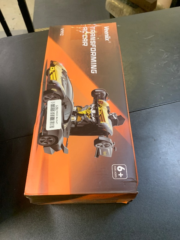 Photo 1 of V992 Transform Remote Control Car, Transform Robot RC Cars, 1:14 Scale, 2-in-1 Robot Toy Car with Sound & Light, Gesture Sensing, Automatic Deformation, Great Gift Toys for Boys and Girls 4-6 (Golden)