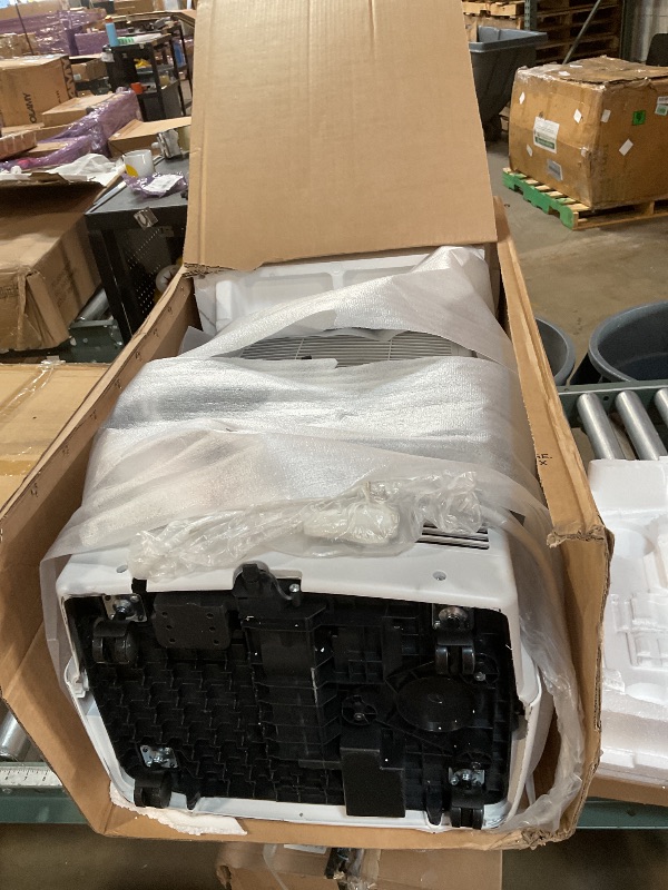 Photo 1 of Amazon Basics 4-In-1 Portable Air Conditioner, 13500 BTU (ASHRAE), Cools Up to 550 Sqf, Portable AC with Cool/Heat/Dry (Dehumidifier)/Fan-Only Functions, Auto Mode, Sleep Mode, Timer, White