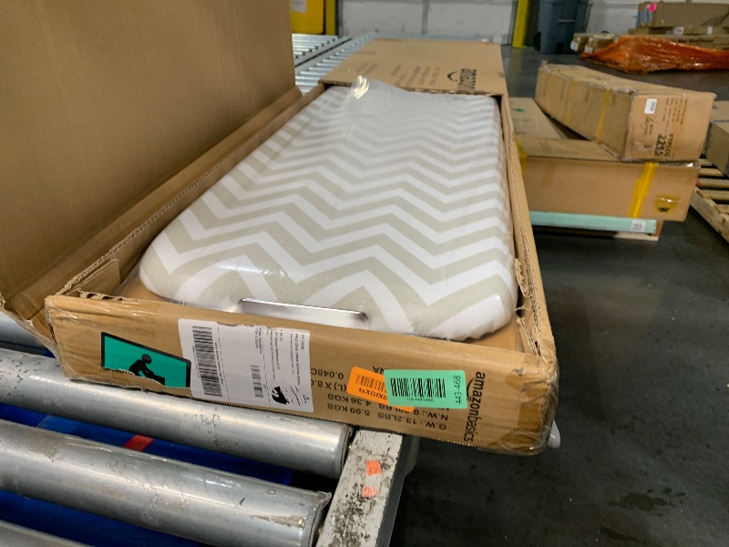 Photo 1 of Amazon Basics Full-Size Ironing Board - 4-Leg Fold-Up, Chevron Removable Cover, 60"L x 14"W x 38"H