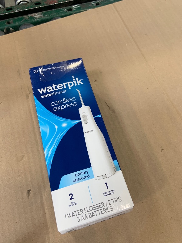 Photo 1 of Waterpik Cordless Express Water Flosser, Battery Operated & Portable for Travel & Home, ADA Accepted, Waterproof for Shower Use, White WF-02, Packaging May Vary