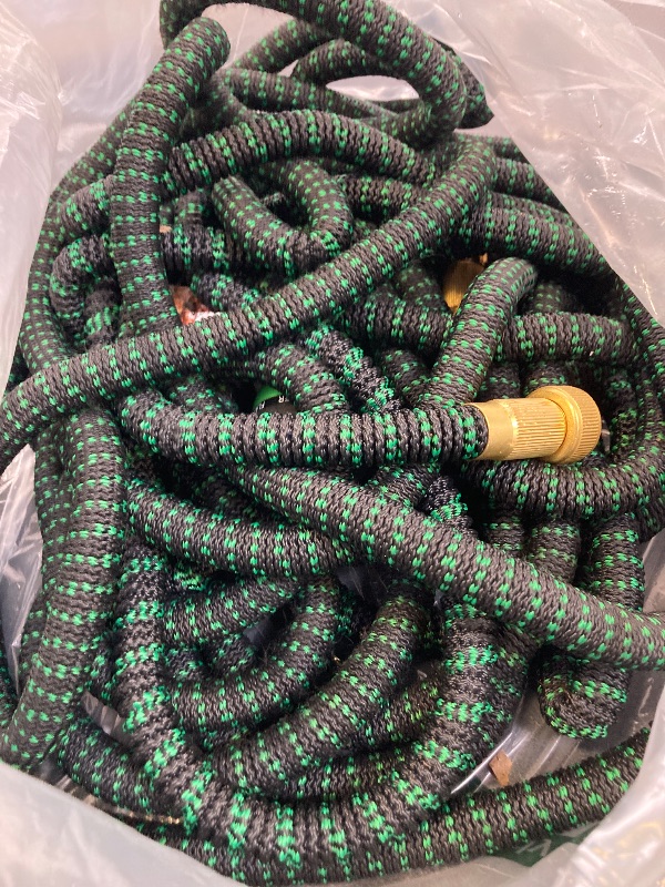 Photo 1 of Flexi Hose with 8 Function Nozzle, 150FT - Lightweight Expandable Garden Hose, No-Kink Flexibility, 3/4 Inch Solid Brass Fittings and Double Latex Core - Green