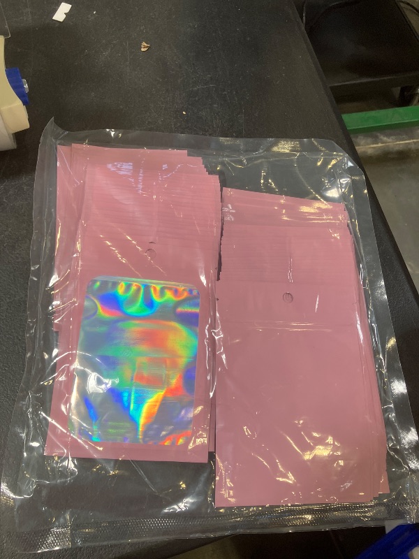 Photo 1 of 100Pcs Holographic Packaging Bags 4x6 Inch Resealable Foil Mylar Bags for Small Business Party Favor Pouch Packaging and Sample Storage (Pink)