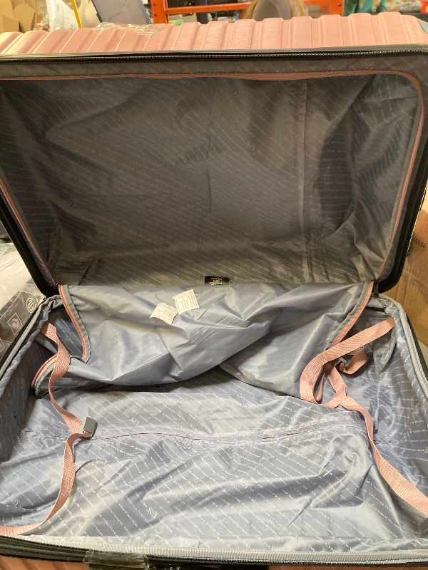 Photo 1 of **WHEEL DAMAGED** U.S. Traveler Boren Expandable Hardside Rugged Travel Luggage with 8 Spinner Wheels, Rose Pink, Checked-Large 30-Inch