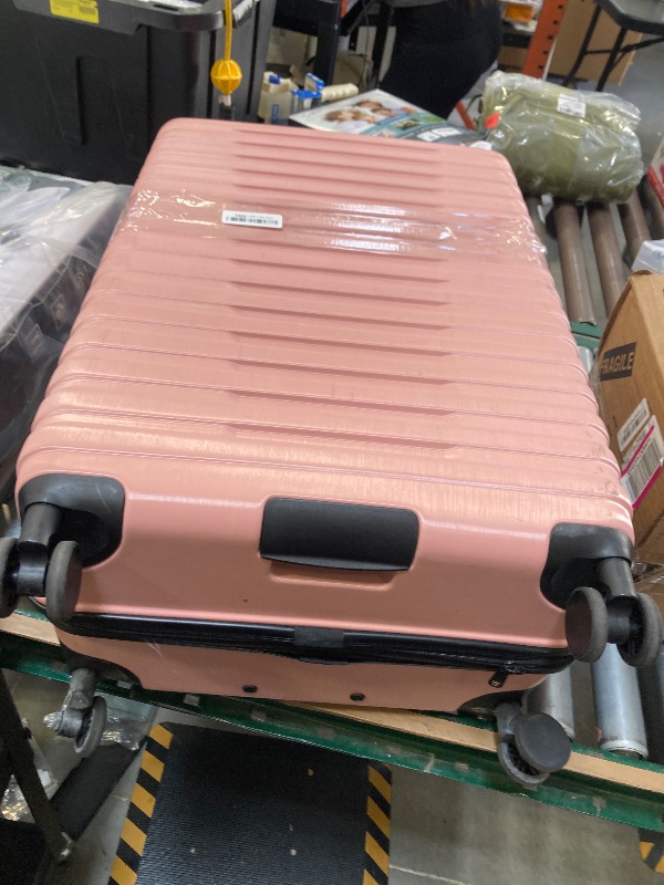 Photo 1 of **WHEEL DAMAGED** U.S. Traveler Boren Expandable Hardside Rugged Travel Luggage with 8 Spinner Wheels, Rose Pink, Checked-Large 30-Inch
