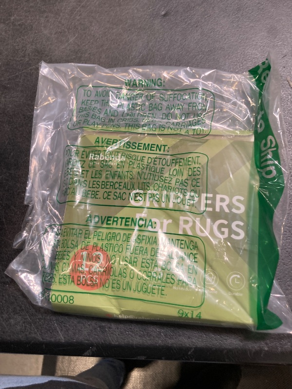 Photo 1 of Rabenda 12 Pcs Rug Tape, Non Slip Rug Pads Grippers for Hardwood Floors and Tiles, Reusable Carpet Tape for Area Rugs, Double-Sided Adhesive Rug Stickers Keep Corners Flat (Black)