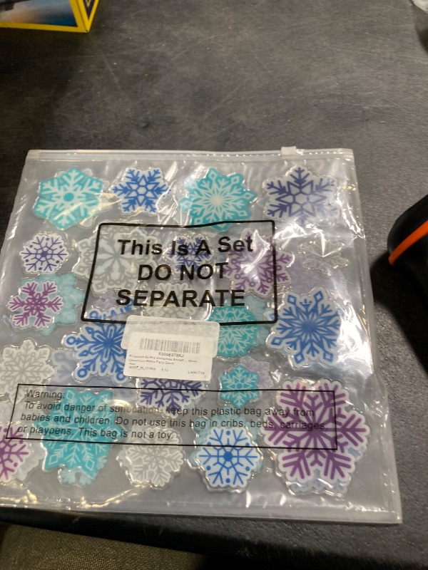 Photo 1 of Pickmesh 45 Pcs Winter Snowflake Window Gel Clings Removable Reusable Snowflake Thick Gel Clings Blue Purple Silver Winter Window Wonderland Stickers Decal for Glass Classroom Home Party Decor