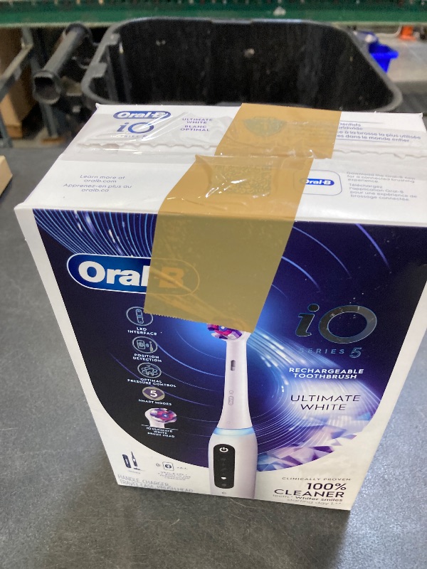 Photo 1 of Oral-B iO Series 5 Ultimate White Rechargeable Electric Toothbrush with Visible Pressure Sensor, 2 Minute Timer, 5 Cleaning Settings, 1 Replacement Toothbrush Heads, and Travel Case, White