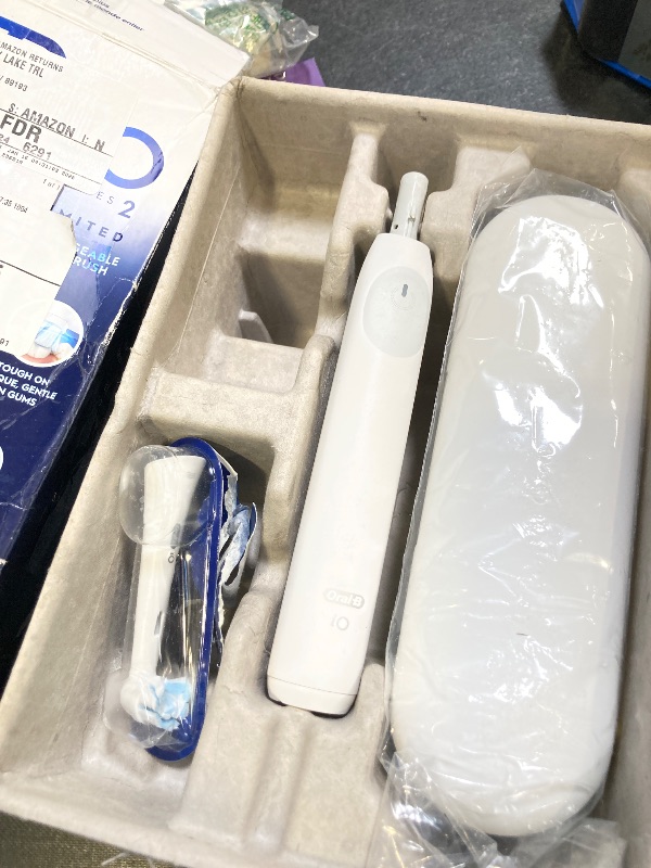 Photo 1 of Oral-B iO Simple Clean Rechargeable Electric Powered Toothbrush, Pure White with 1 Gentle Care Brush Head and 1 White Travel Case - Automatic Pressure Sensor to Protect Gums - 3 Modes -2 Min Timer